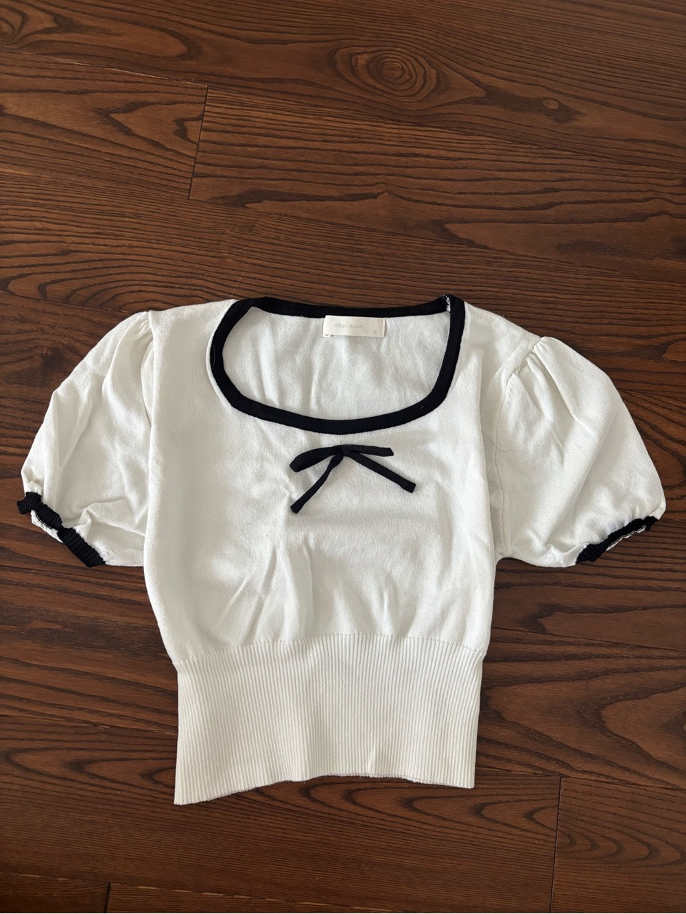 White Short-Sleeve Knit Top with Black Trim and Bow